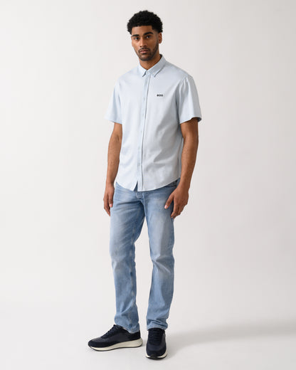 full lenght shot of a model wearing a BOSS Green ST_Motion Mens Short Sleeve Shirt in Open Blue 460