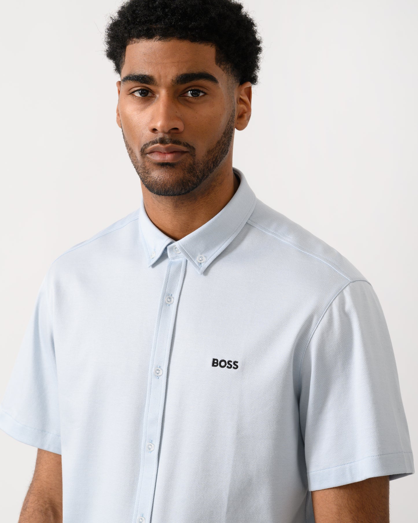 close up shot of a model wearing a BOSS Green ST_Motion Mens Short Sleeve Shirt in Open Blue 460