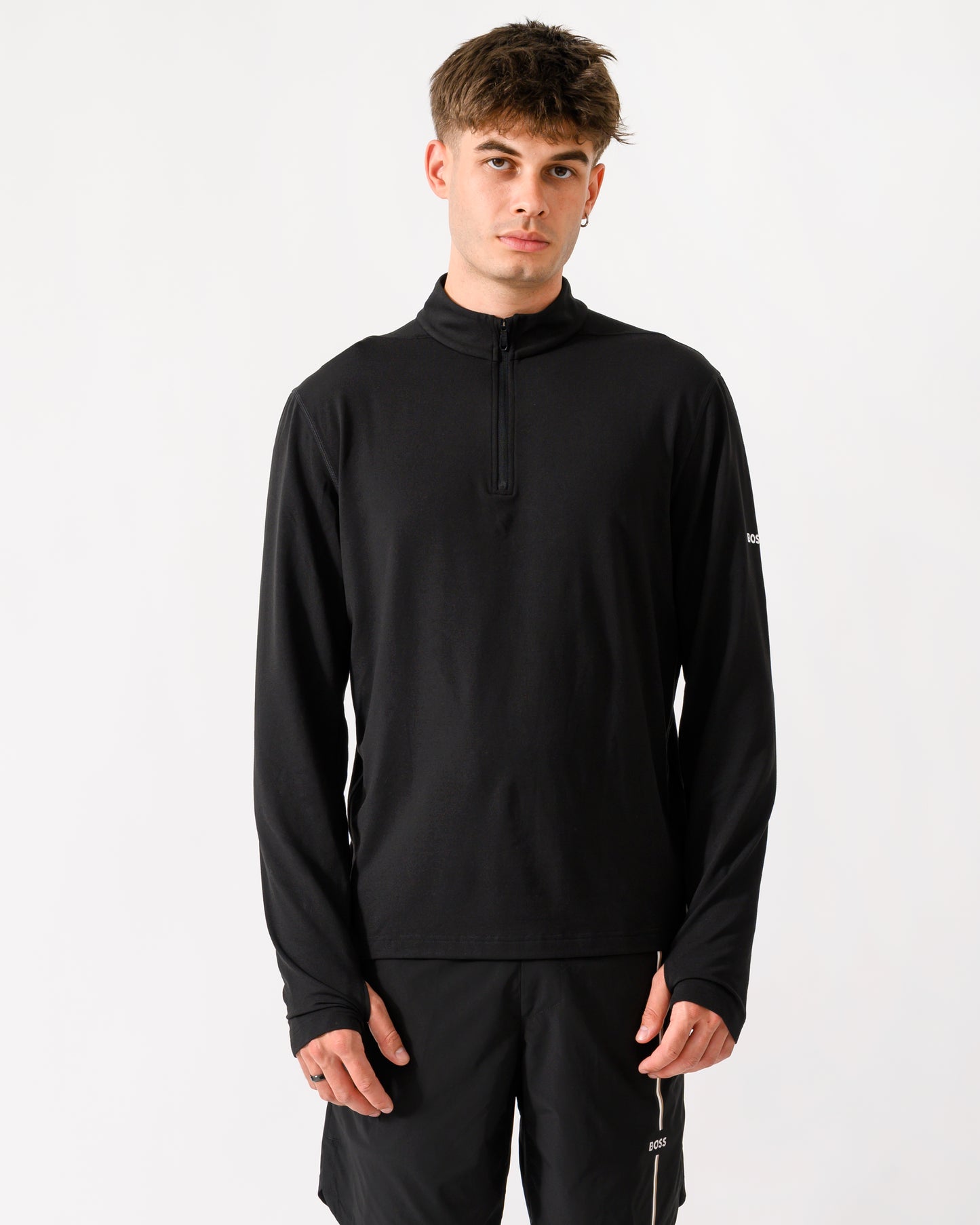 model wearing a BOSS Green SW Active Mens Quarter Zip Sweatshirt in Black 001