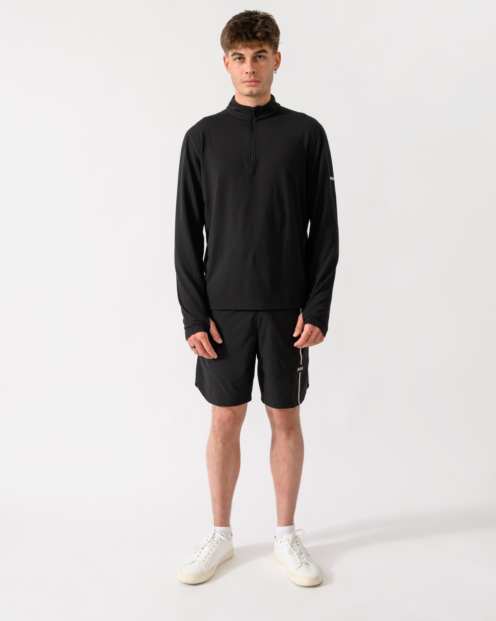 full length shot of model wearing a BOSS Green SW Active Mens Quarter Zip Sweatshirt in Black 001
