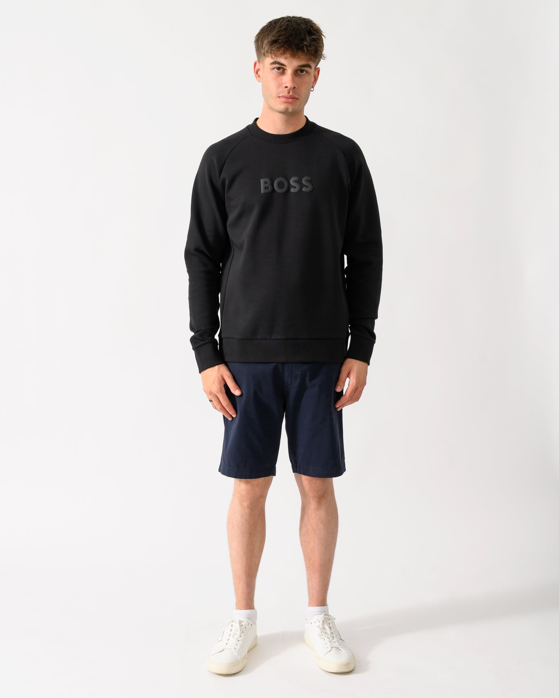 full length shot of a model wearing a BOSS Green Salbo Mens Crew Neck Sweatshirt with Tonal Logo in Black 001
