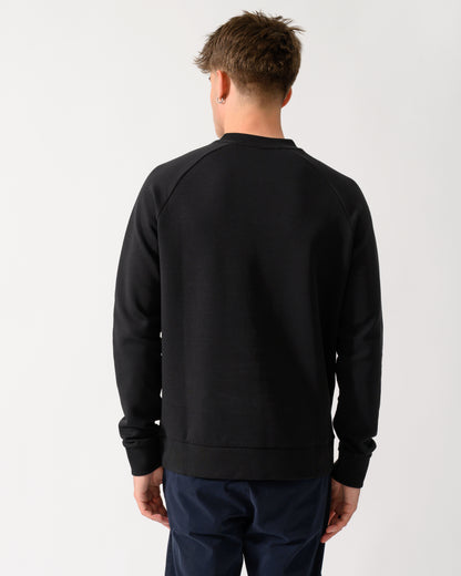 back shot of a model wearing a BOSS Green Salbo Mens Crew Neck Sweatshirt with Tonal Logo in Black 001