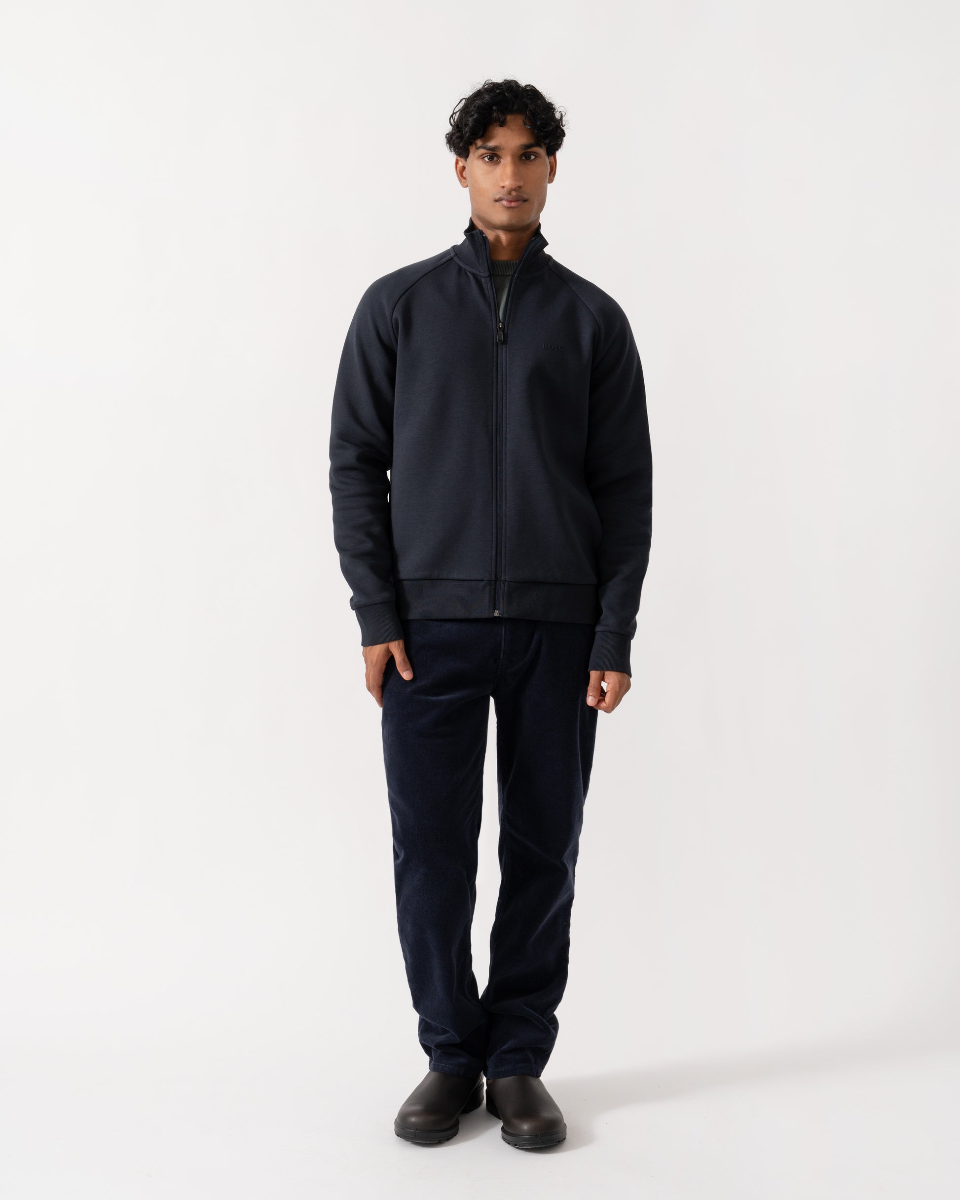Man wearing BOSS Green Skaz Mens Full Zip Funnel Neck Sweatshirt with Tonal Logo - Dark Blue 402