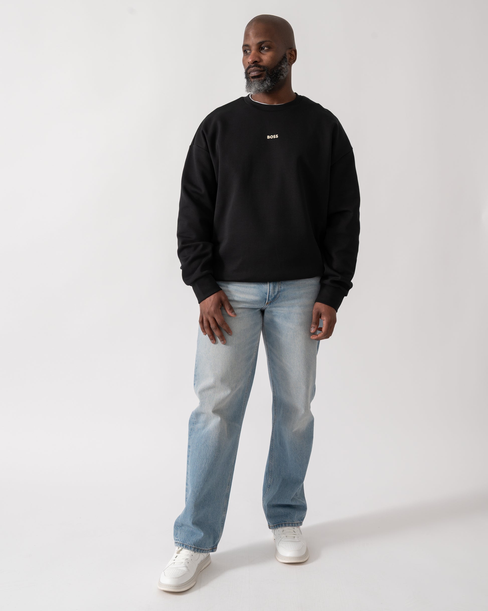 Full length shot of a Model wearing a BOSS Green Stenson Mens Crew Neck Sweatshirt in Black
