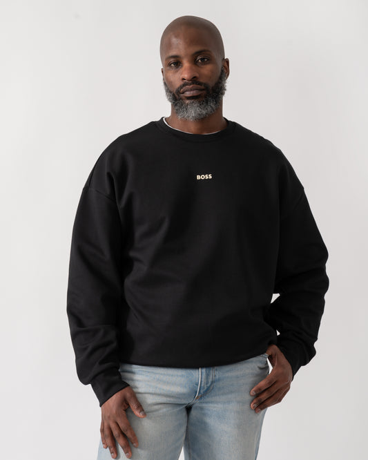 Model wearing a BOSS Green Stenson Mens Crew Neck Sweatshirt in Black