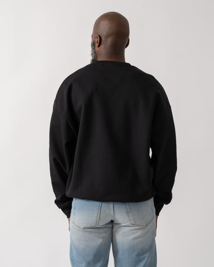 back shot of a Model wearing a BOSS Green Stenson Mens Crew Neck Sweatshirt in Black