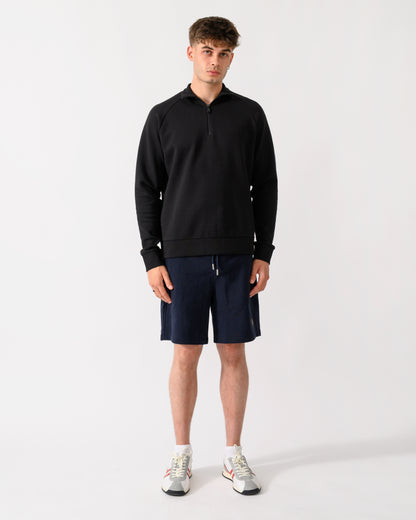 full length shot of a model wearing a BOSS Green Sweat Mens 1/4 Zip Sweatshirt in Black 001