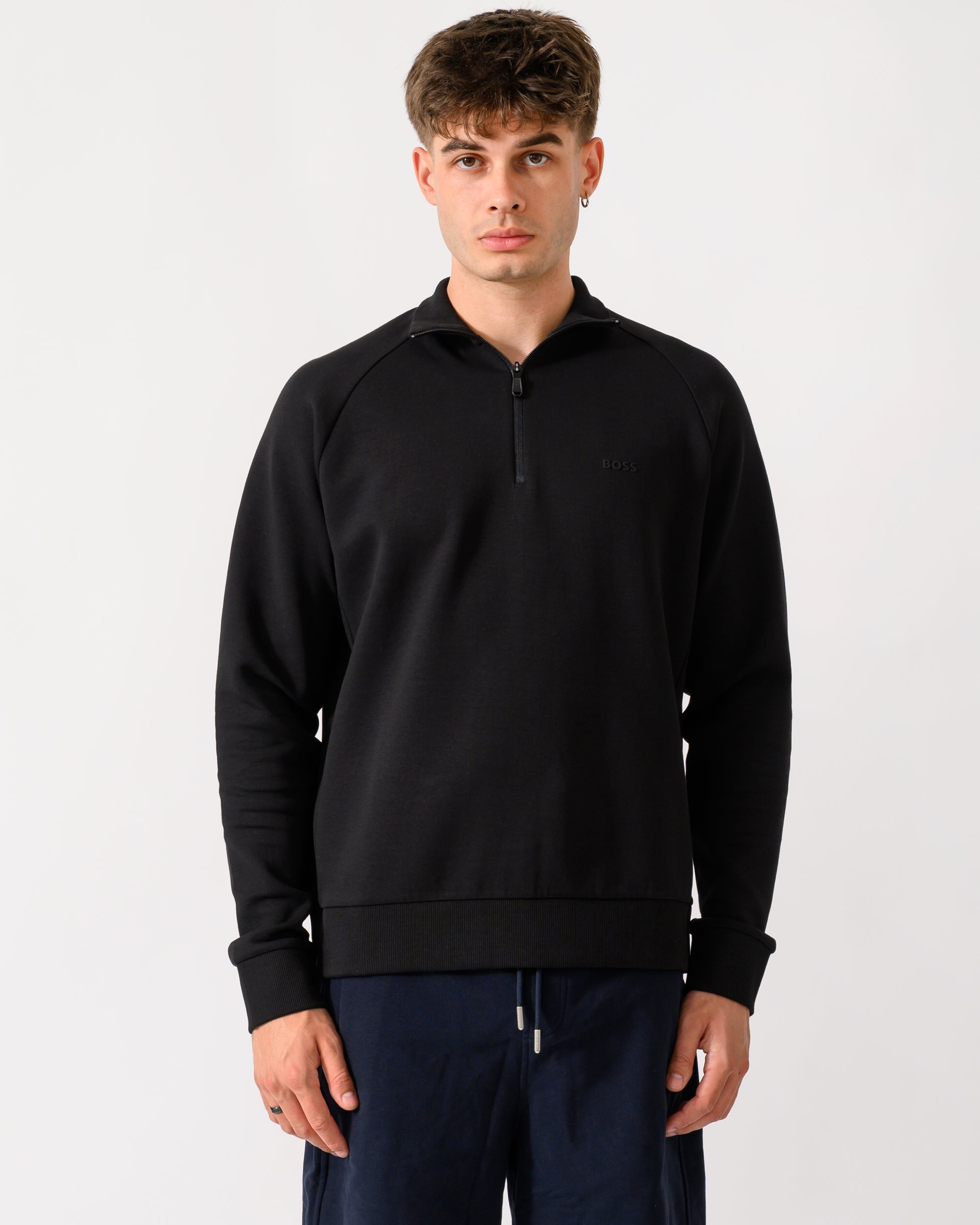 model wearing a BOSS Green Sweat Mens 1/4 Zip Sweatshirt in Black 001