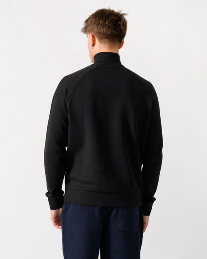 back shot of a model wearing a BOSS Green Sweat Mens 1/4 Zip Sweatshirt in Black 001