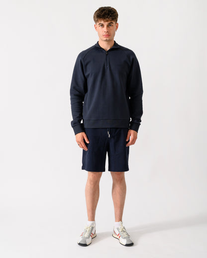 full length shot of a model wearing a BOSS Green Sweat Mens quarter Zip Sweatshirt in Dark Blue 402
