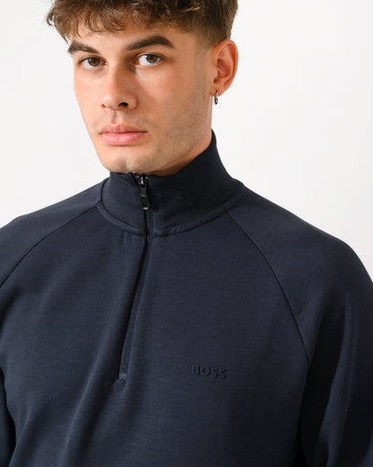 close up shot of a model wearing a BOSS Green Sweat Mens quarter Zip Sweatshirt in Dark Blue 402