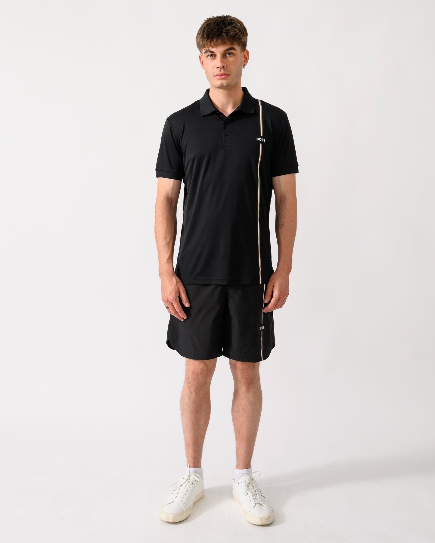 full length shot of a model wearing a BOSS Green TOC Game Mens Polo Shirt in Black 001