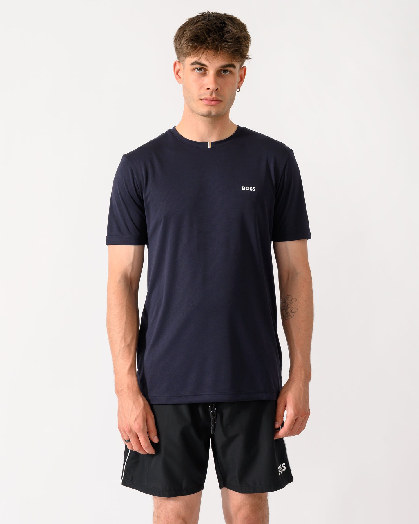 model wearing a BOSS Green TOC Game Mens T-Shirt in Dark Blue 402