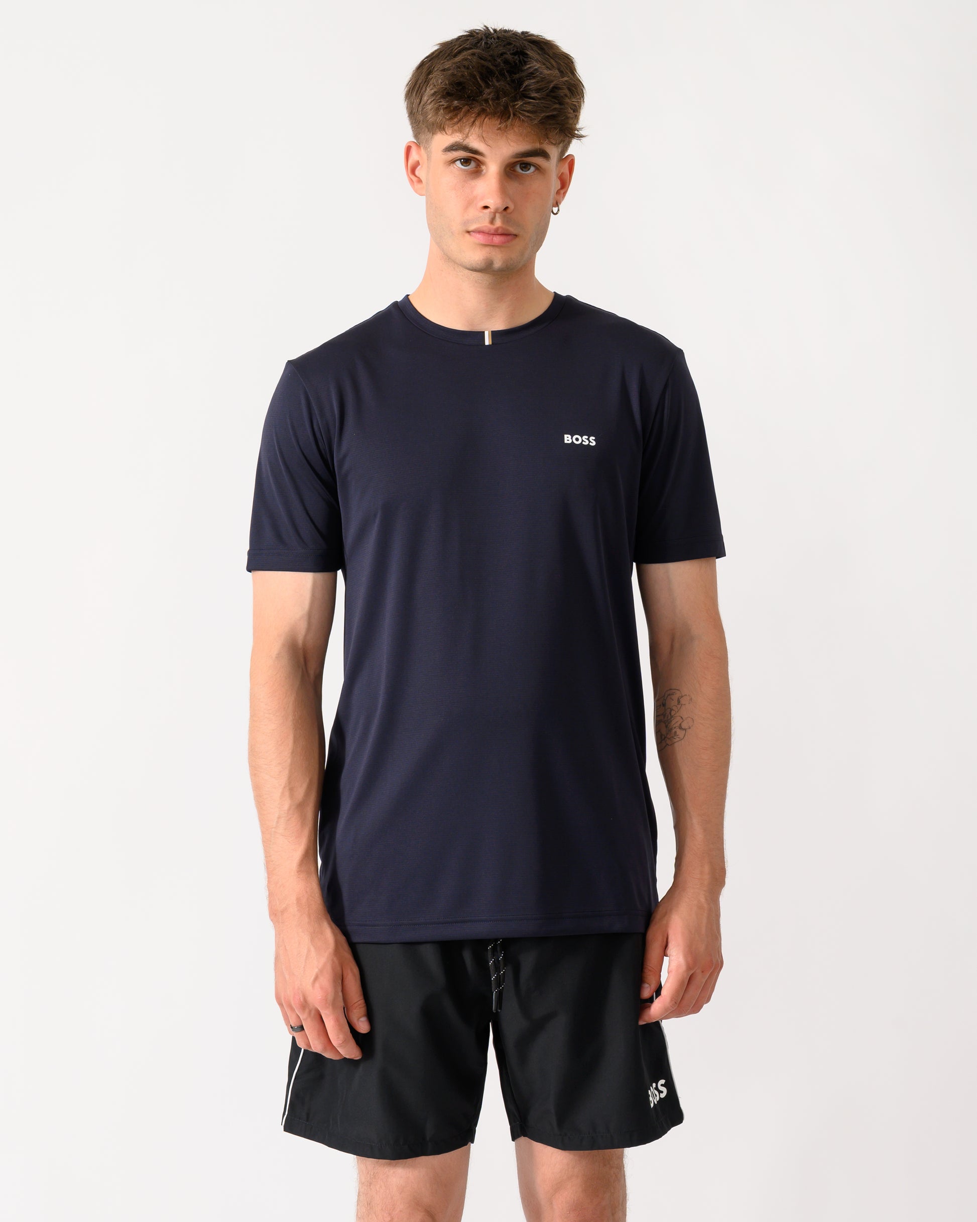 model wearing a BOSS Green TOC Game Mens T-Shirt in Dark Blue 402