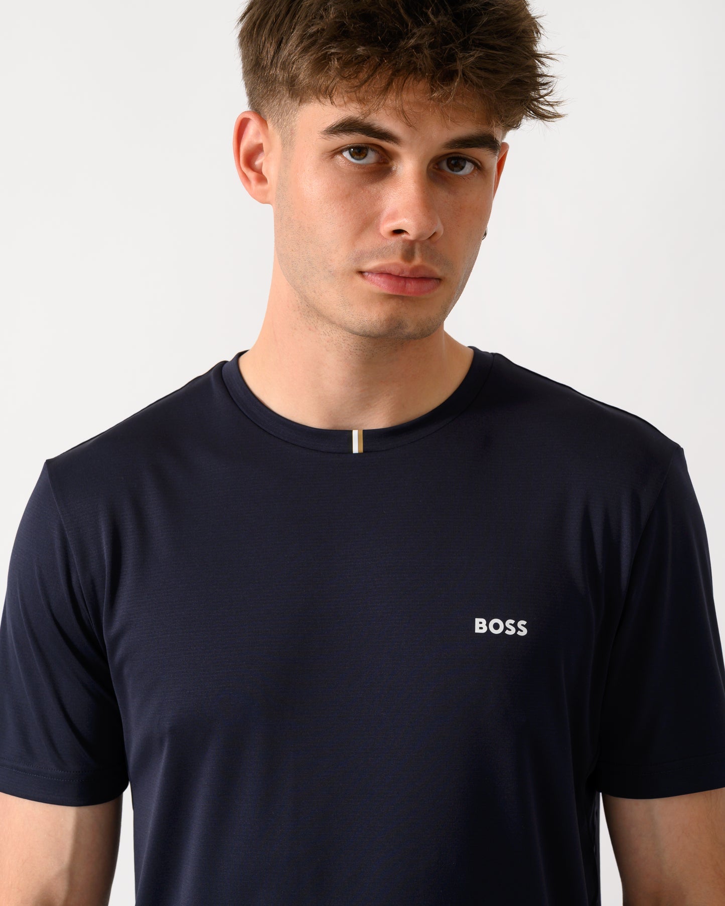close up shot of a model wearing a BOSS Green TOC Game Mens T-Shirt in Dark Blue 402