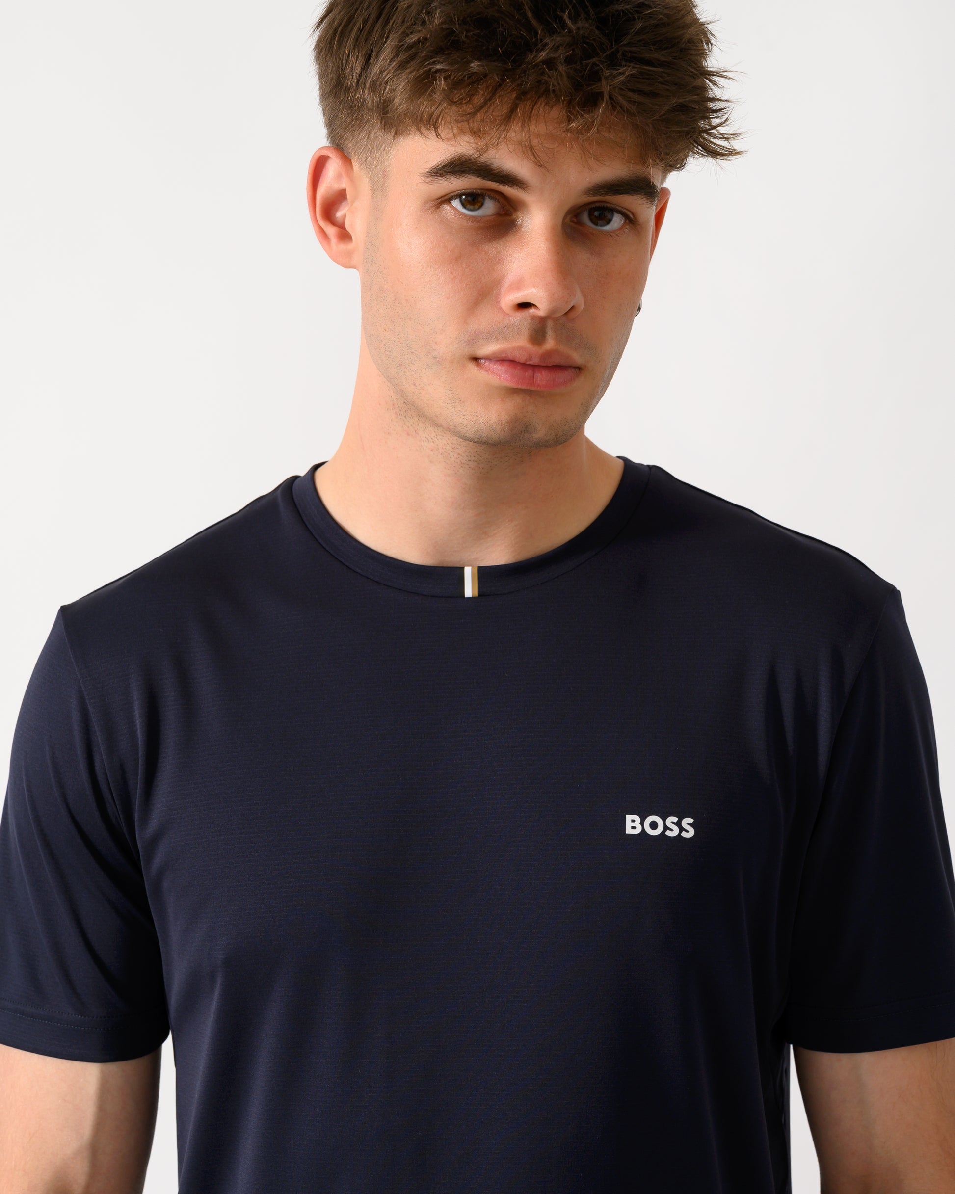 close up shot of a model wearing a BOSS Green TOC Game Mens T-Shirt in Dark Blue 402