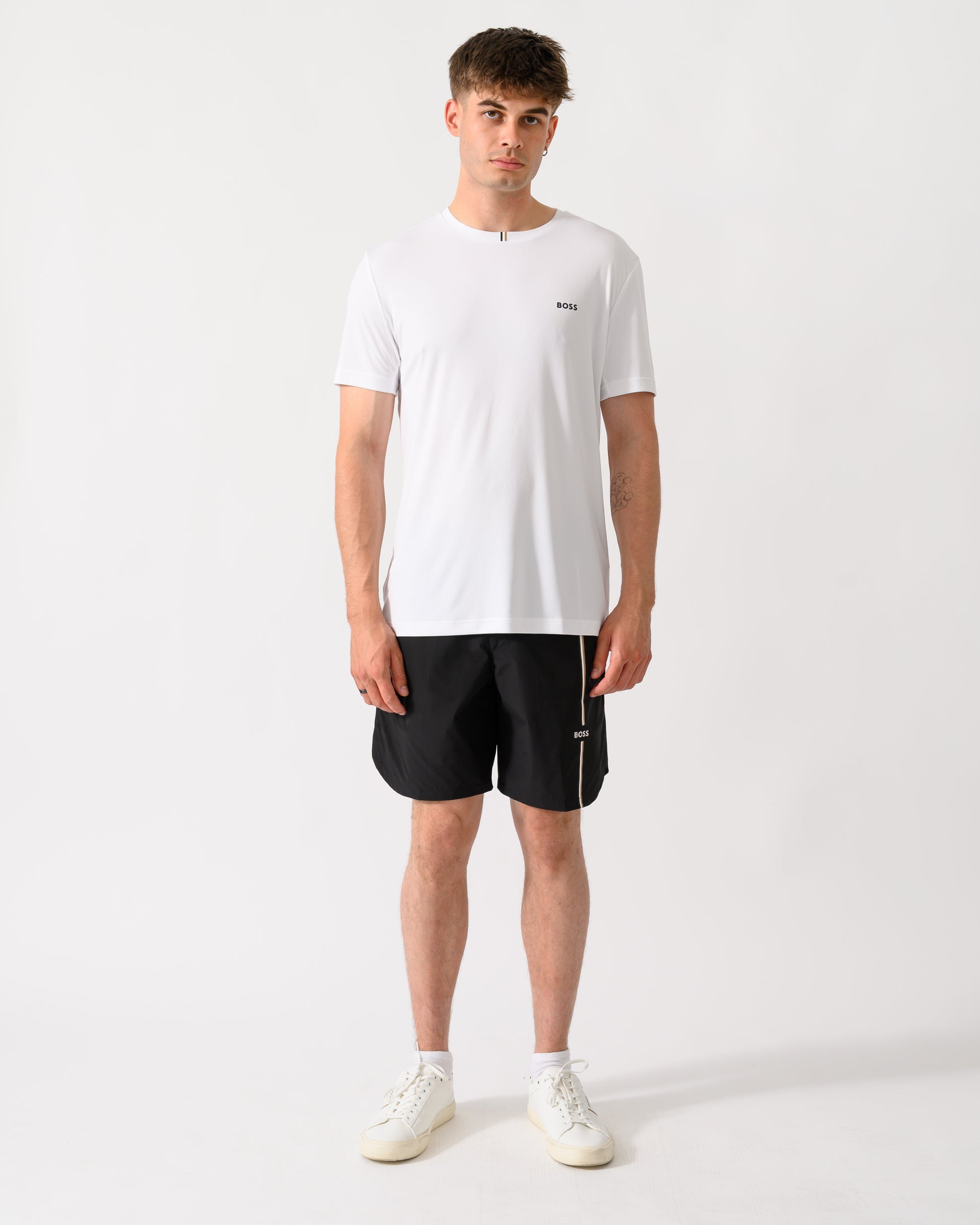 full length shot of a model wearing a BOSS Green TOC Game Mens T-Shirt in White 100