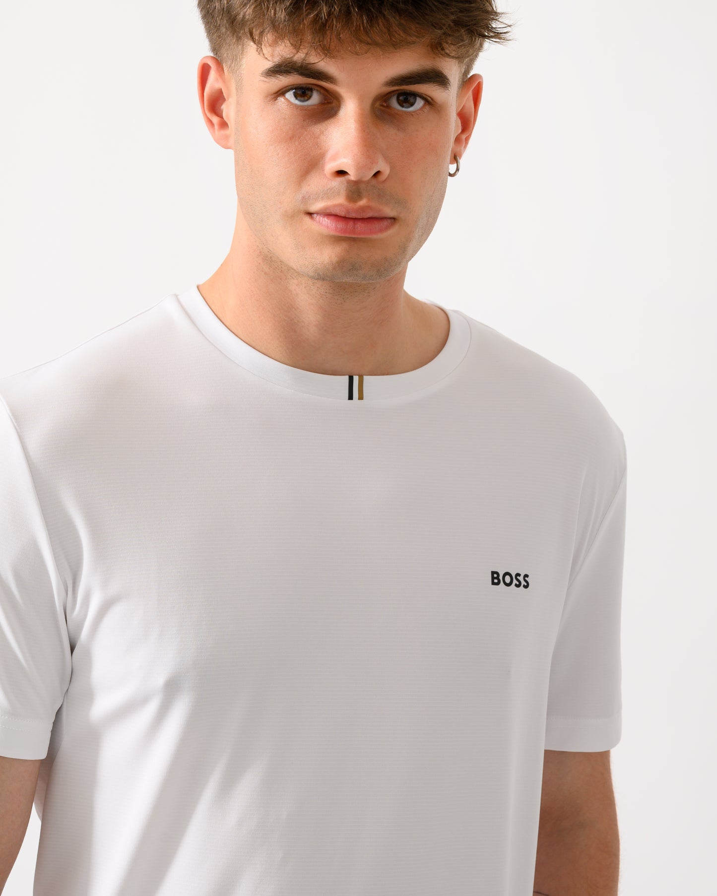 close up shot of a model wearing a BOSS Green TOC Game Mens T-Shirt in White 100