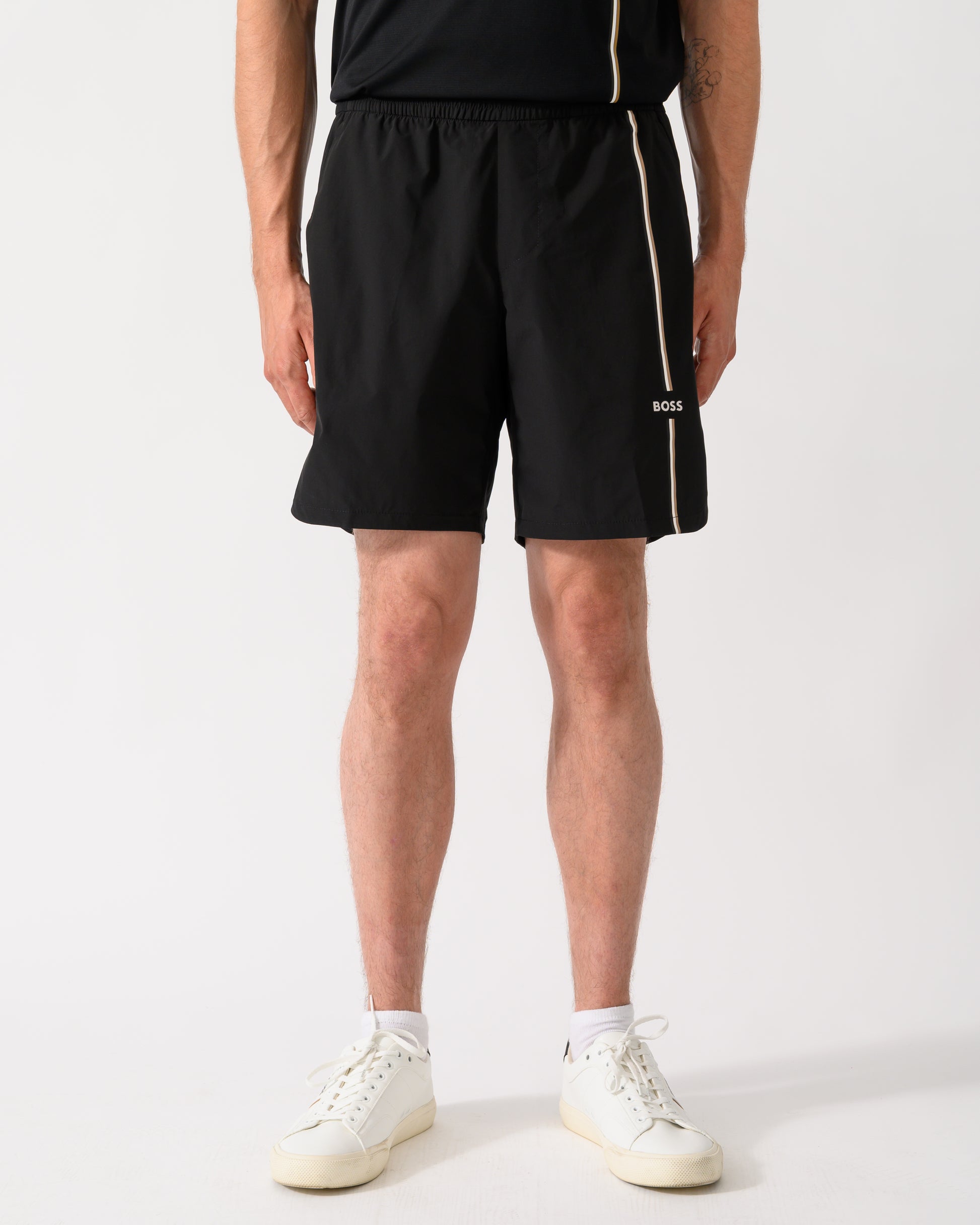 model wearing a BOSS Green TOC Mens Active Tennis Shorts in Innovative NOVA Fabric in Black 001