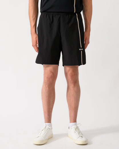 model wearing a BOSS Green TOC Mens Active Tennis Shorts in Innovative NOVA Fabric in Black 001