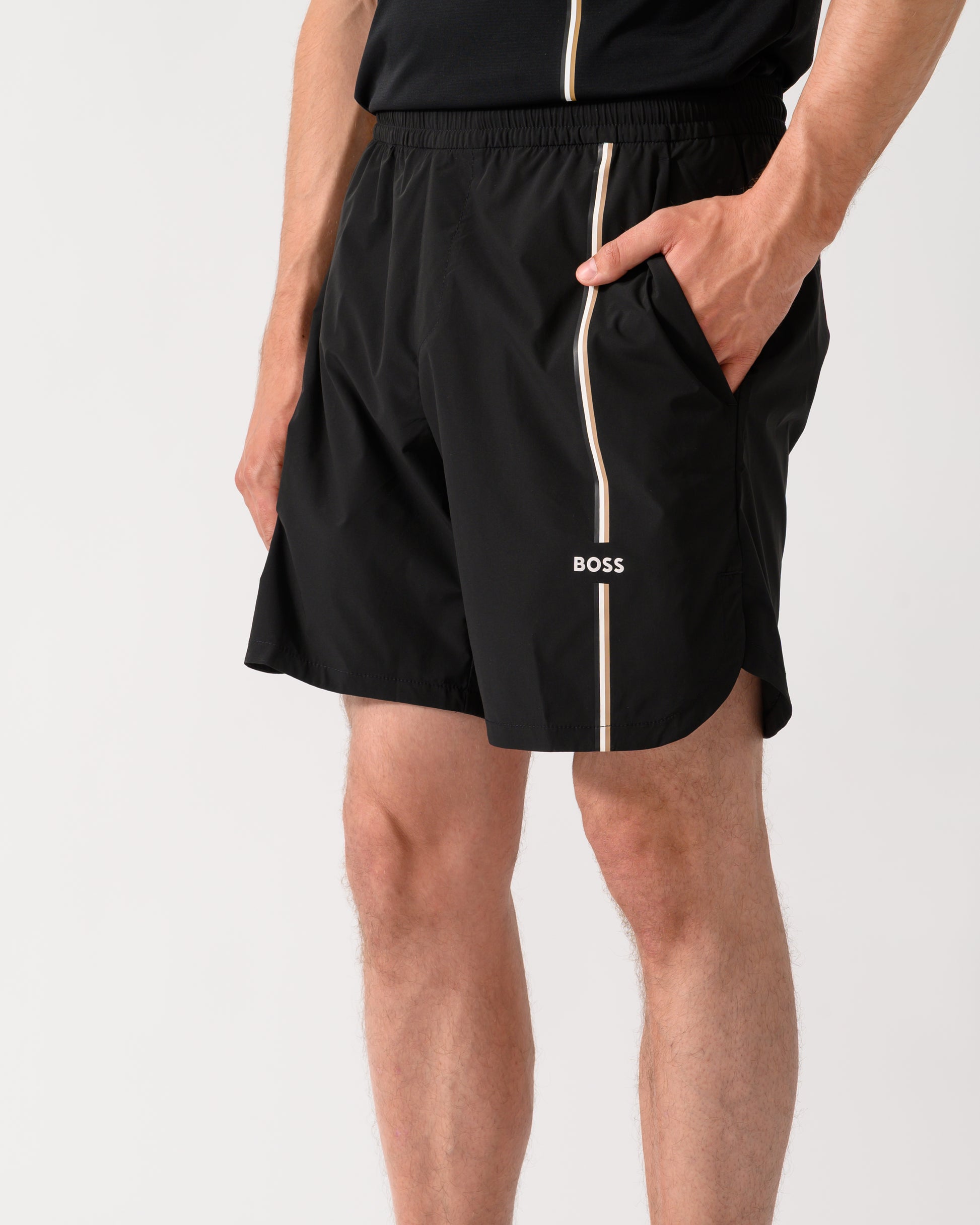 close up shot of a model wearing a BOSS Green TOC Mens Active Tennis Shorts in Innovative NOVA Fabric in Black 001