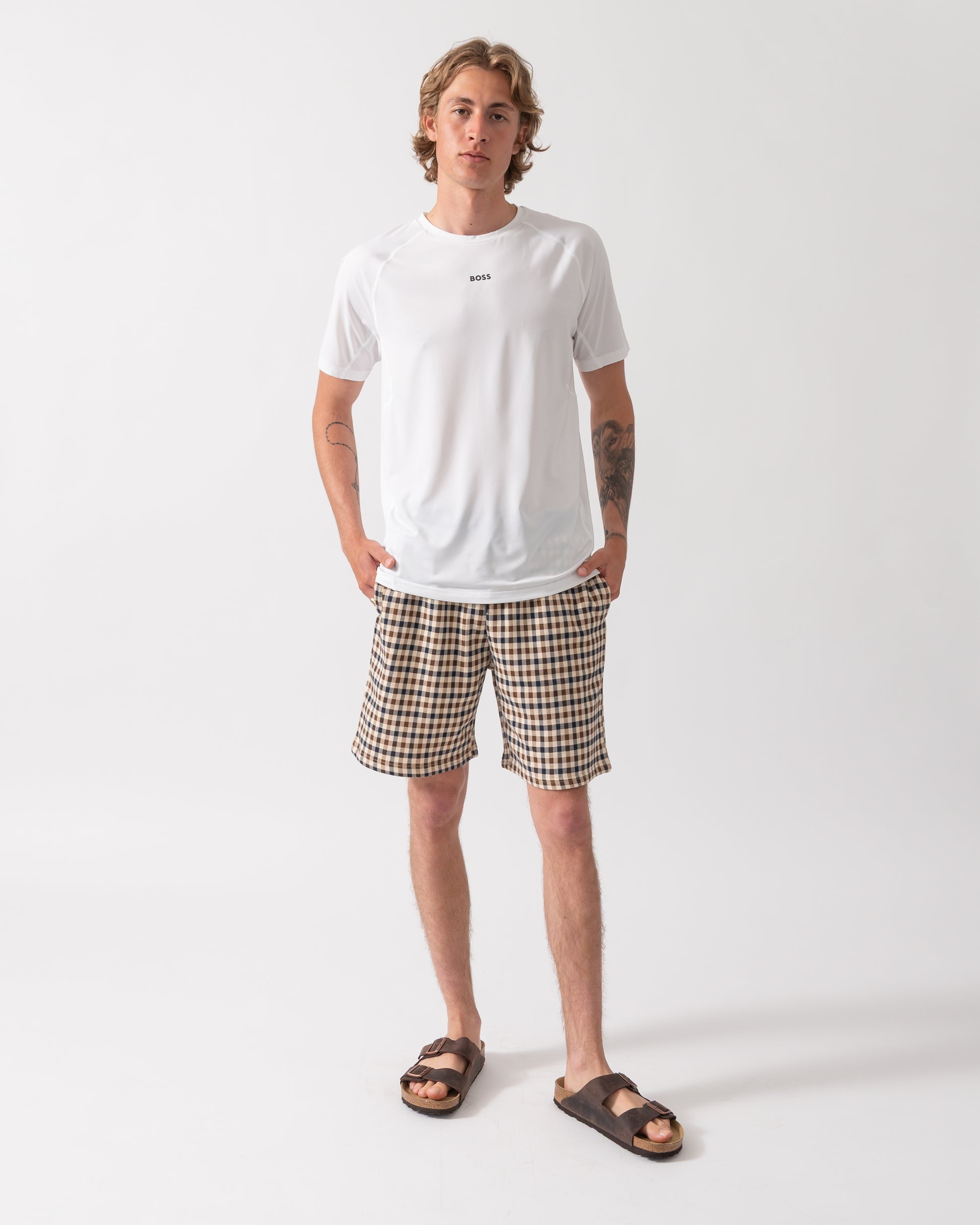 full length shot of a Model wearing a BOSS Green Tee Active Mens T-Shirt in White 100