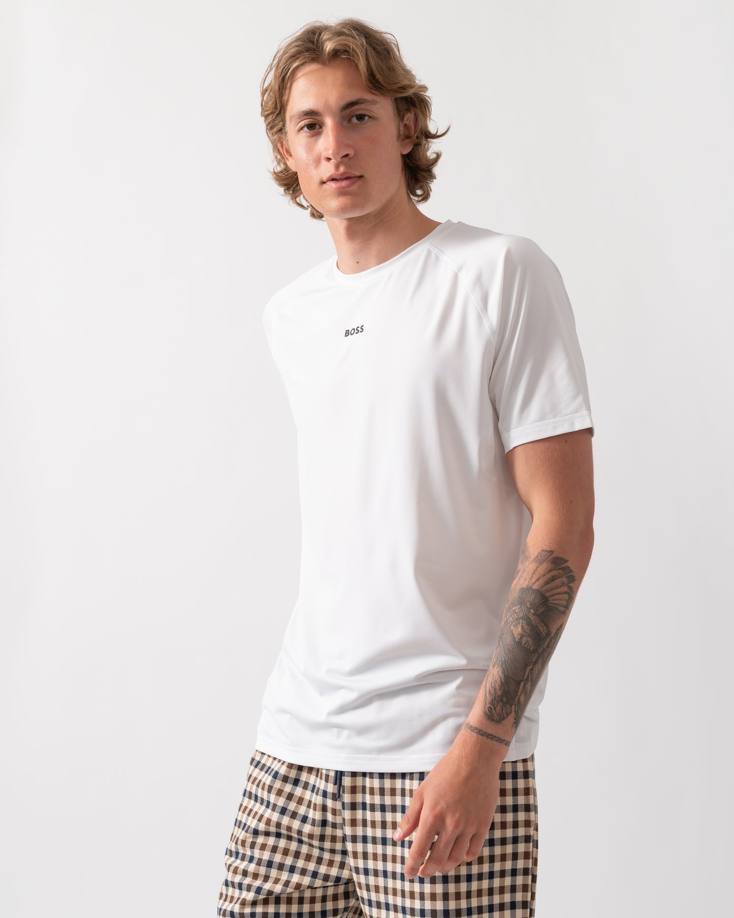 Model wearing a BOSS Green Tee Active Mens T-Shirt in White 100