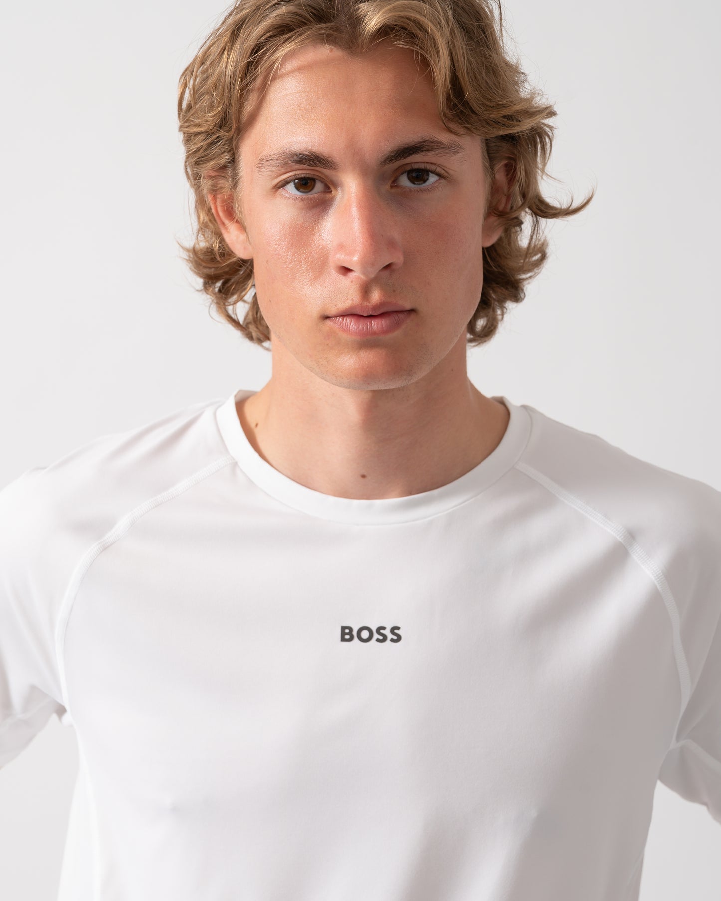close up shot of a Model wearing a BOSS Green Tee Active Mens T-Shirt in White 100