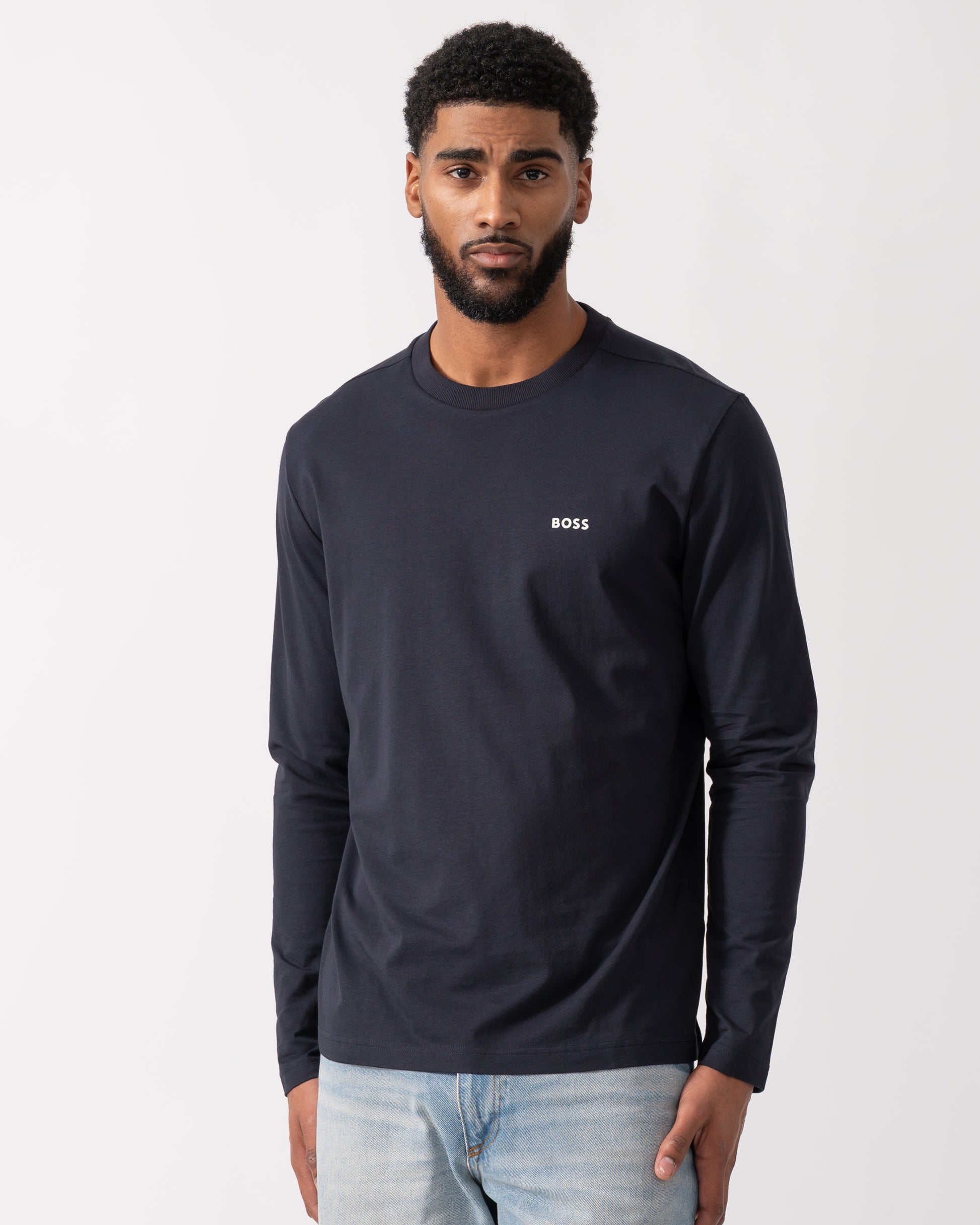 model wearing a BOSS Green Tee Mens Stretch-Cotton T-Shirt with Contrast Logo in Dark Blue