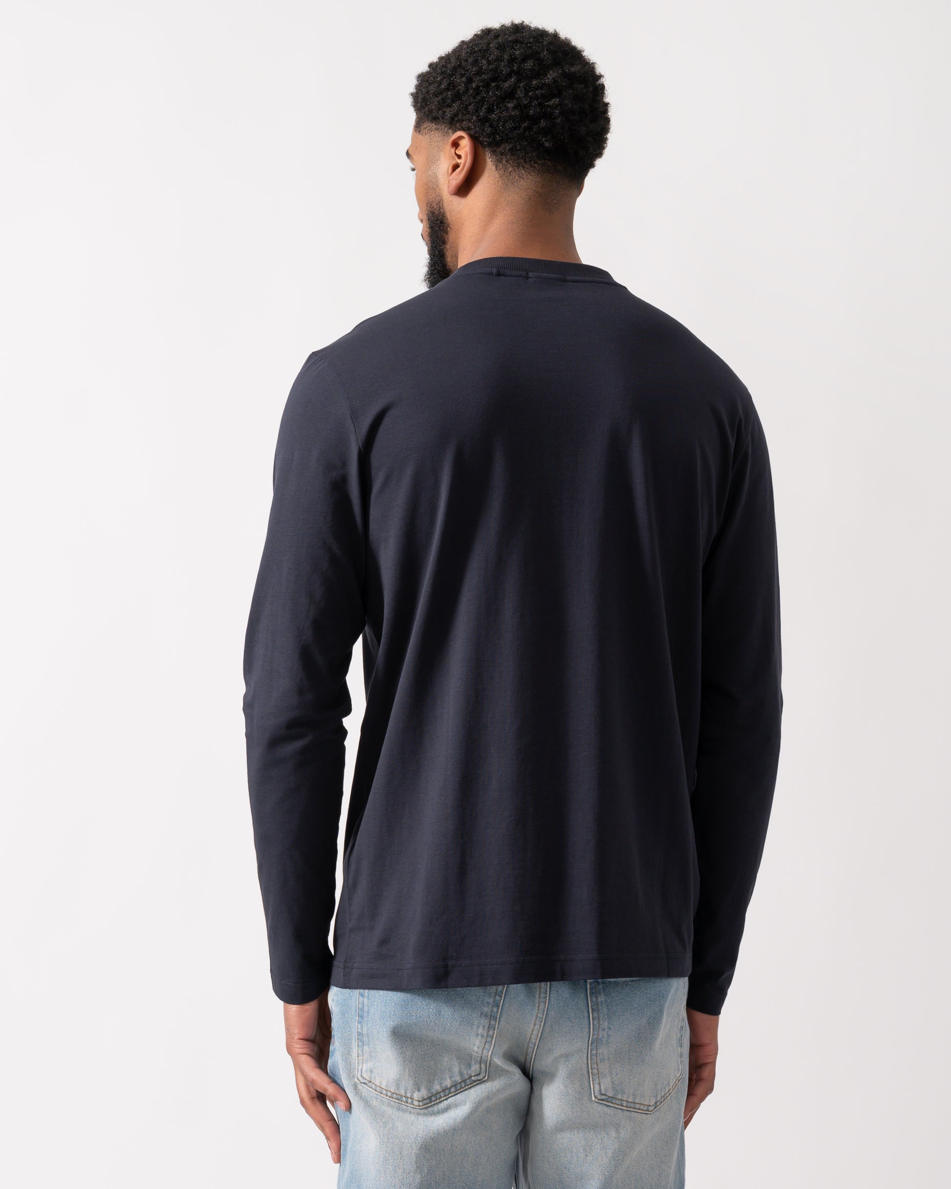 back of a model wearing a BOSS Green Tee Mens Stretch-Cotton T-Shirt with Contrast Logo in Dark Blue