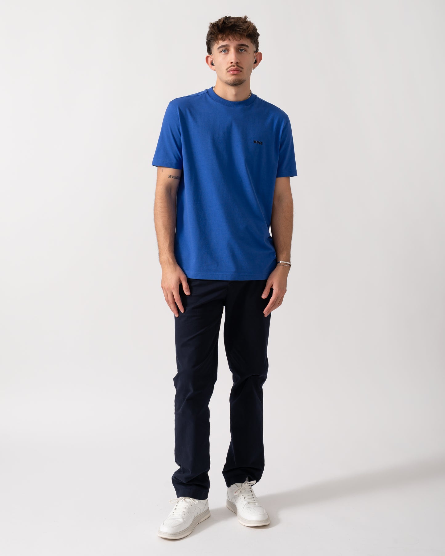 Full length shot of a Model wearing a BOSS Green Tee Mens Stretch Cotton T-Shirt with Contrast Logo in Medium Blue