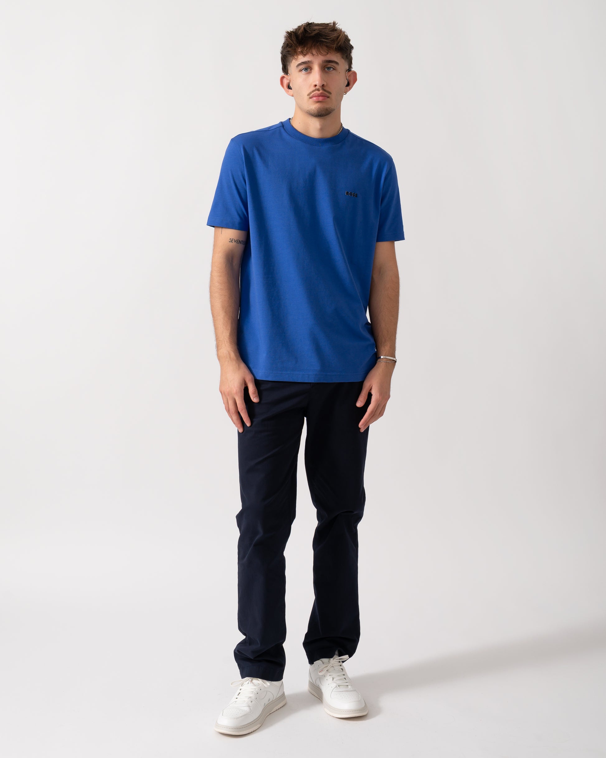 Full length shot of a Model wearing a BOSS Green Tee Mens Stretch Cotton T-Shirt with Contrast Logo in Medium Blue