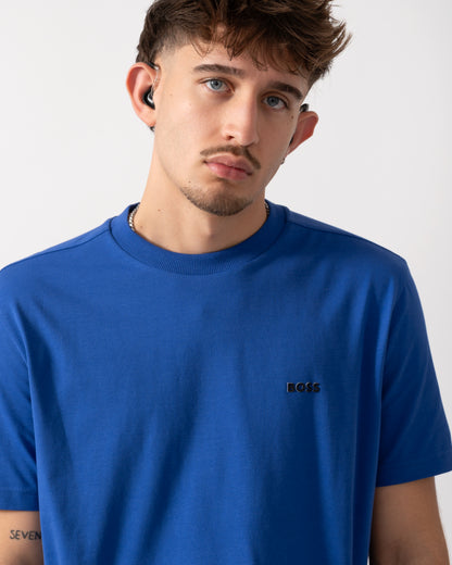 Close up shot of a Model wearing a BOSS Green Tee Mens Stretch Cotton T-Shirt with Contrast Logo in Medium Blue
