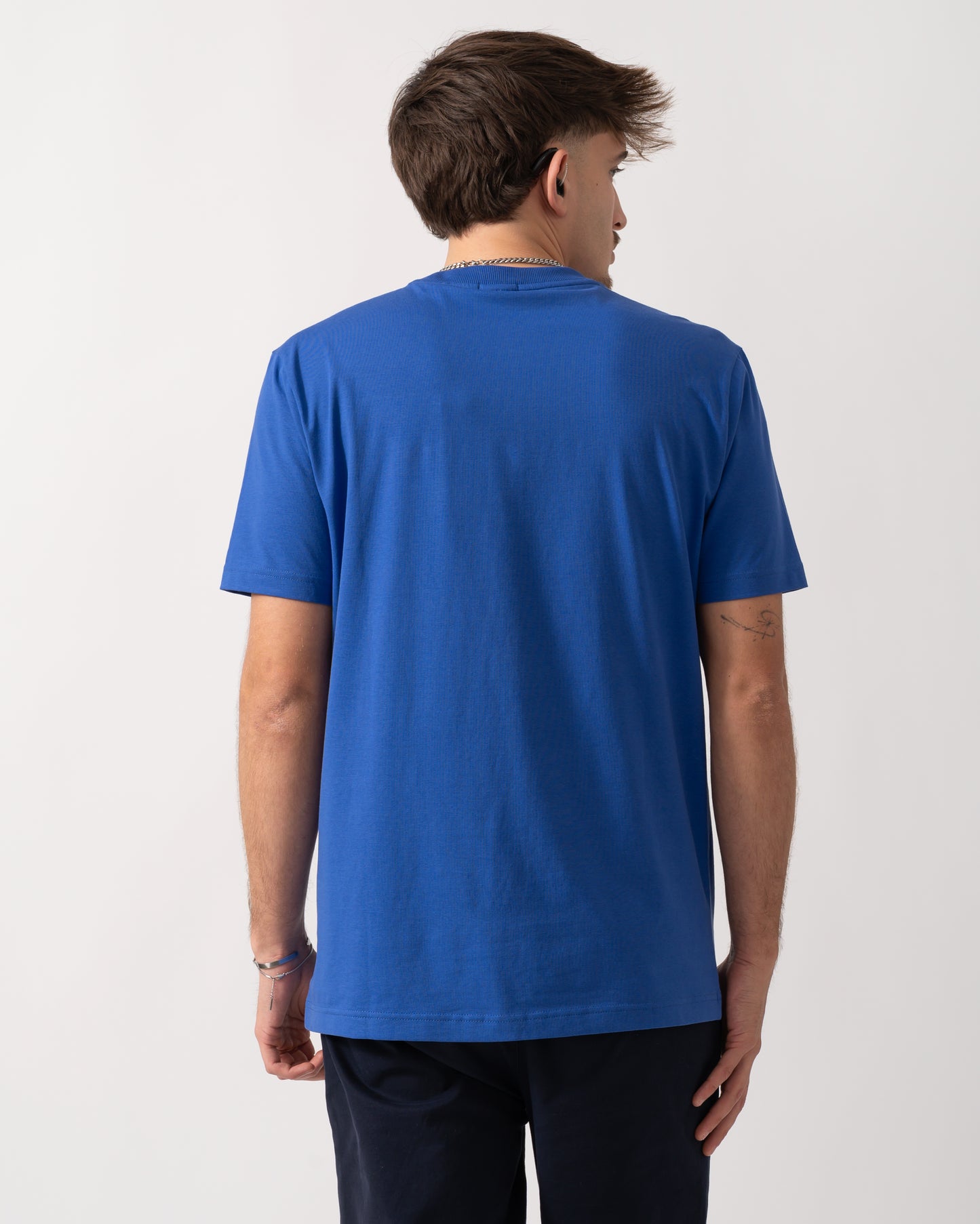 Back shot of a Model wearing a BOSS Green Tee Mens Stretch Cotton T-Shirt with Contrast Logo in Medium Blue