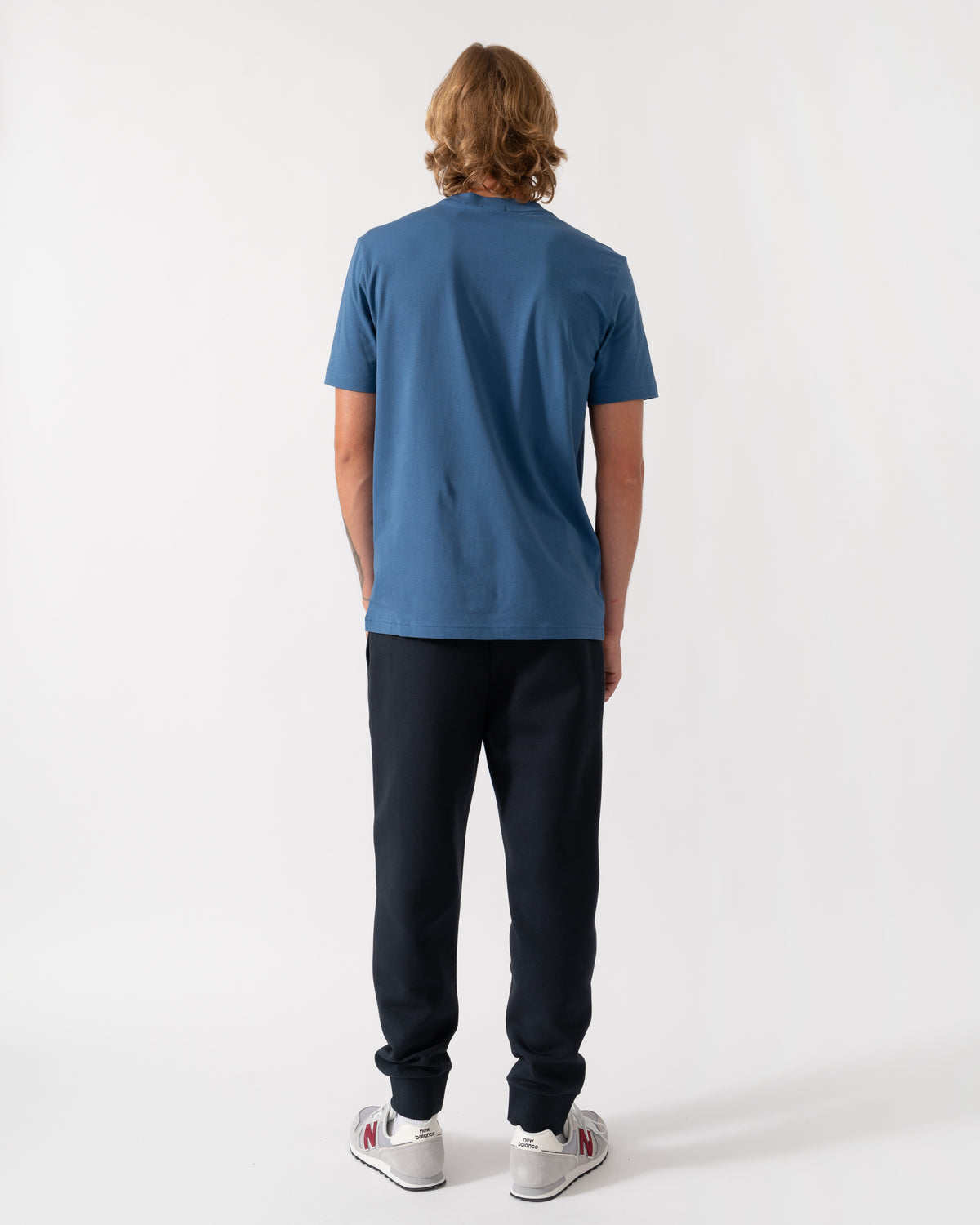 Back of the BOSS Green Hadiko Mens Stretch-cotton track pants with puff-print logo - Dark Blue 402