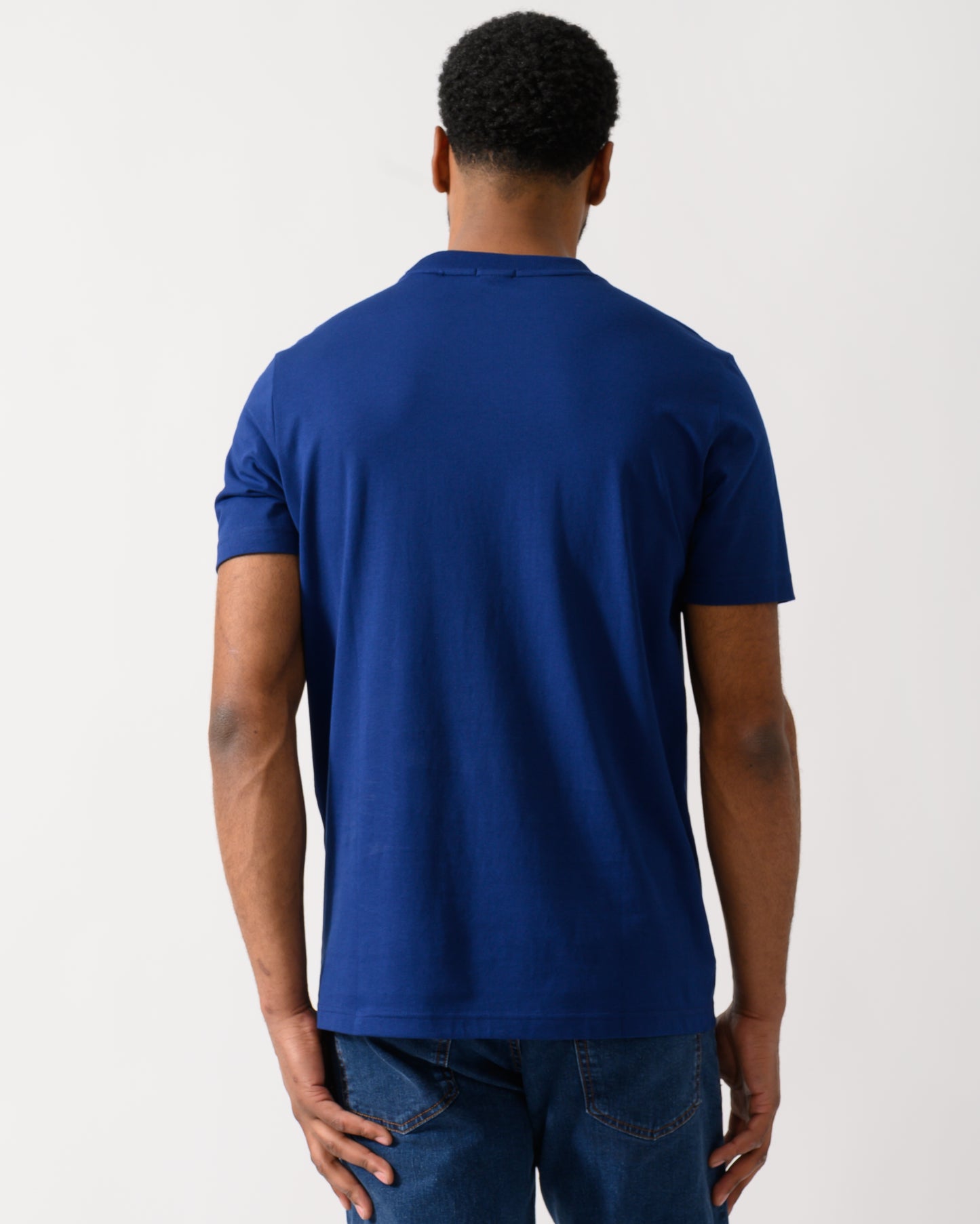 back shot of a model wearing a BOSS Green Tee Mens Stretch Cotton T-Shirt with Contrast Logo in Navy