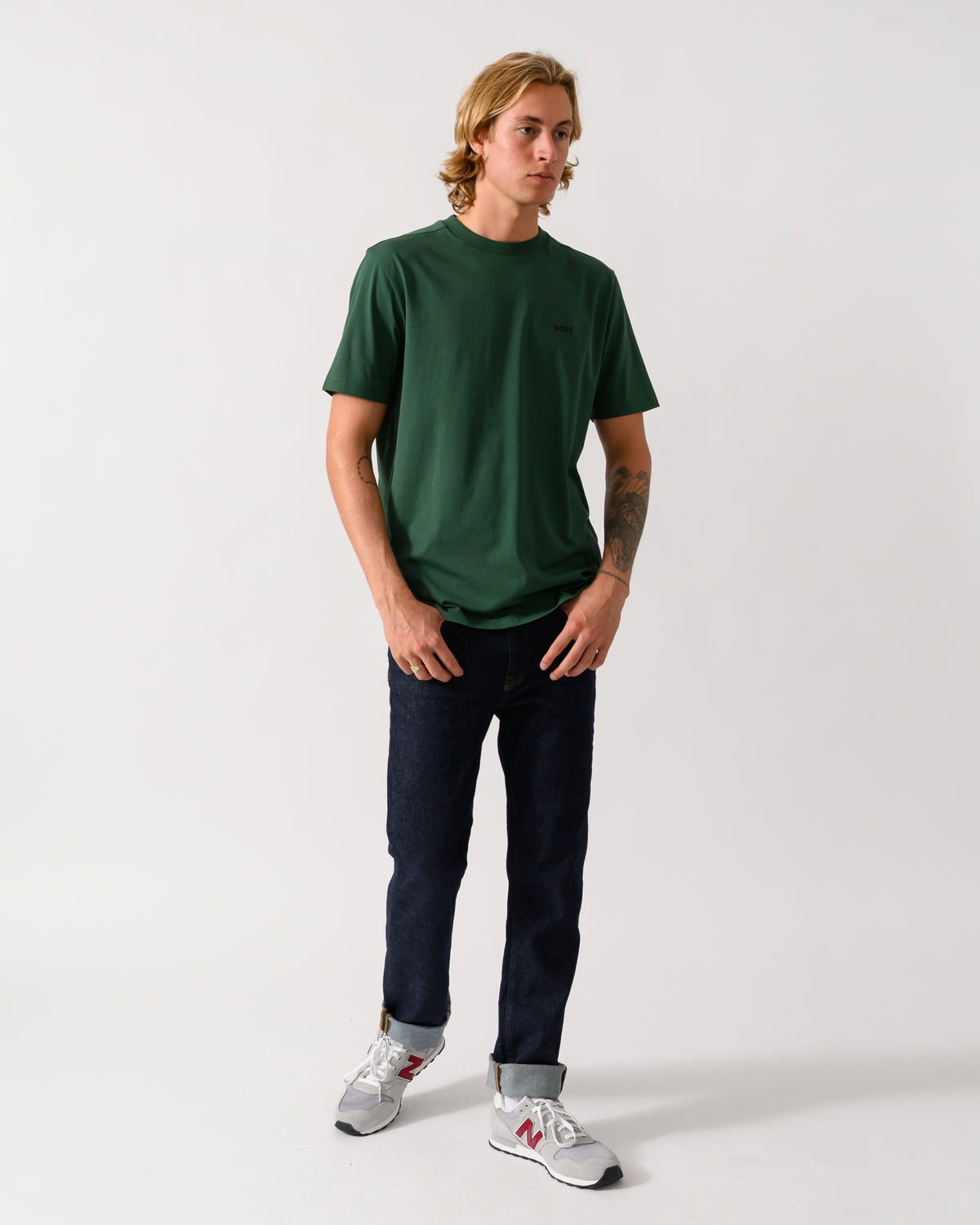 full length of a model wearing a BOSS Green Tee Mens Stretch Cotton T-Shirt with Contrast Logo in Open Green 365