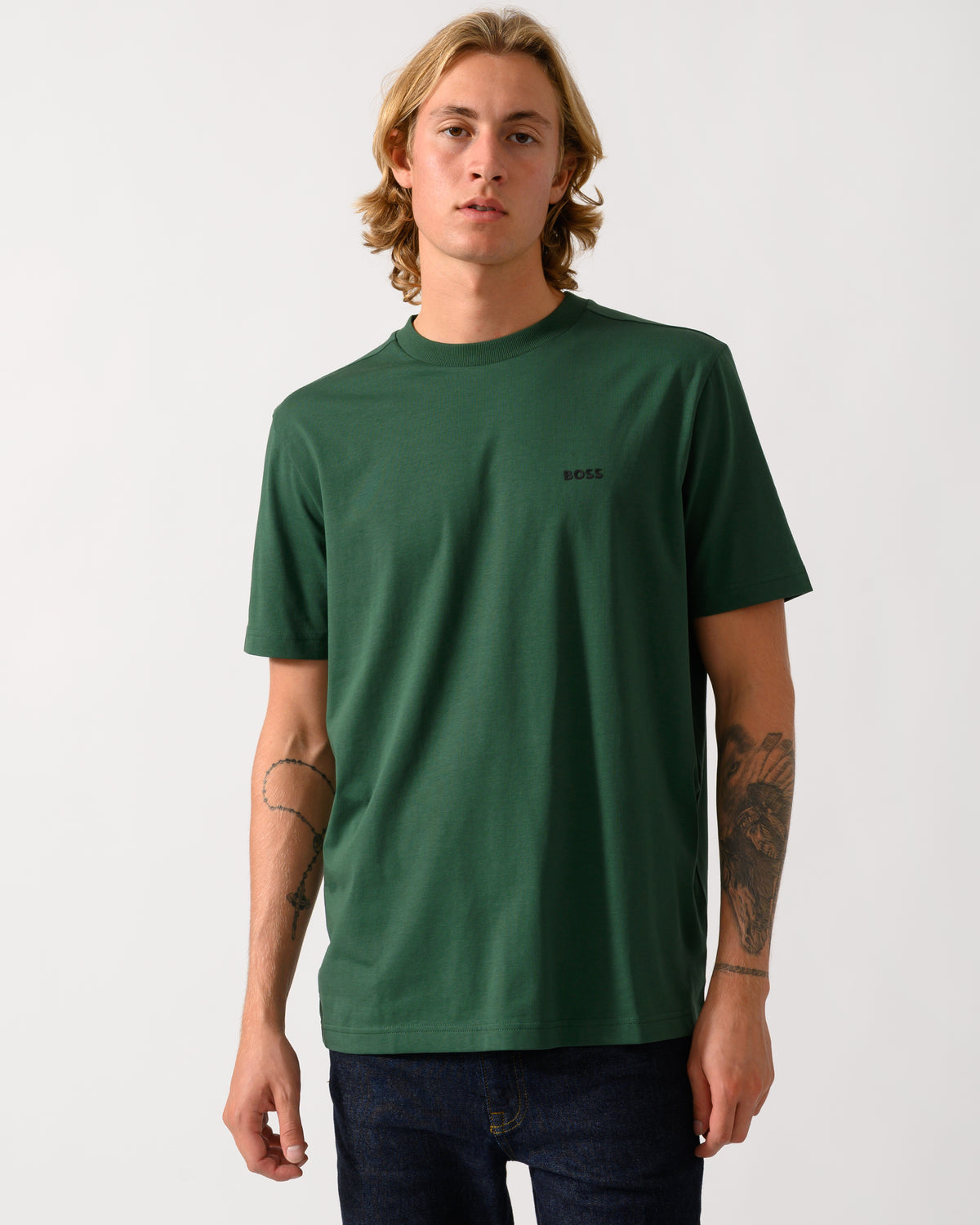 model wearing a BOSS Green Tee Mens Stretch Cotton T-Shirt with Contrast Logo in Open Green 365