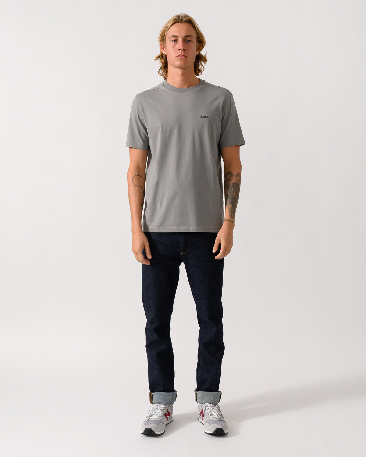 full length of a model wearing a BOSS Green Tee Mens Stretch Cotton T-Shirt with Contrast Logo in Open Grey 063
