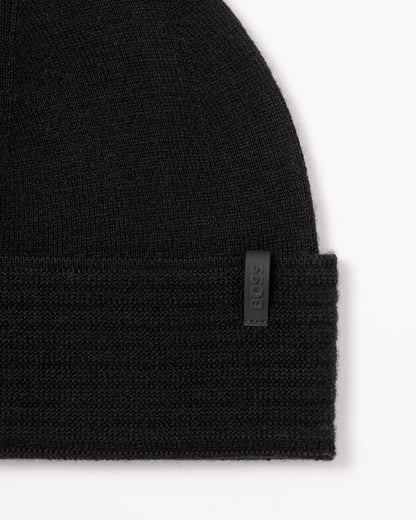 studio photograph showing the logo detail of a BOSS Green Termix Mens Beanie in Black 001