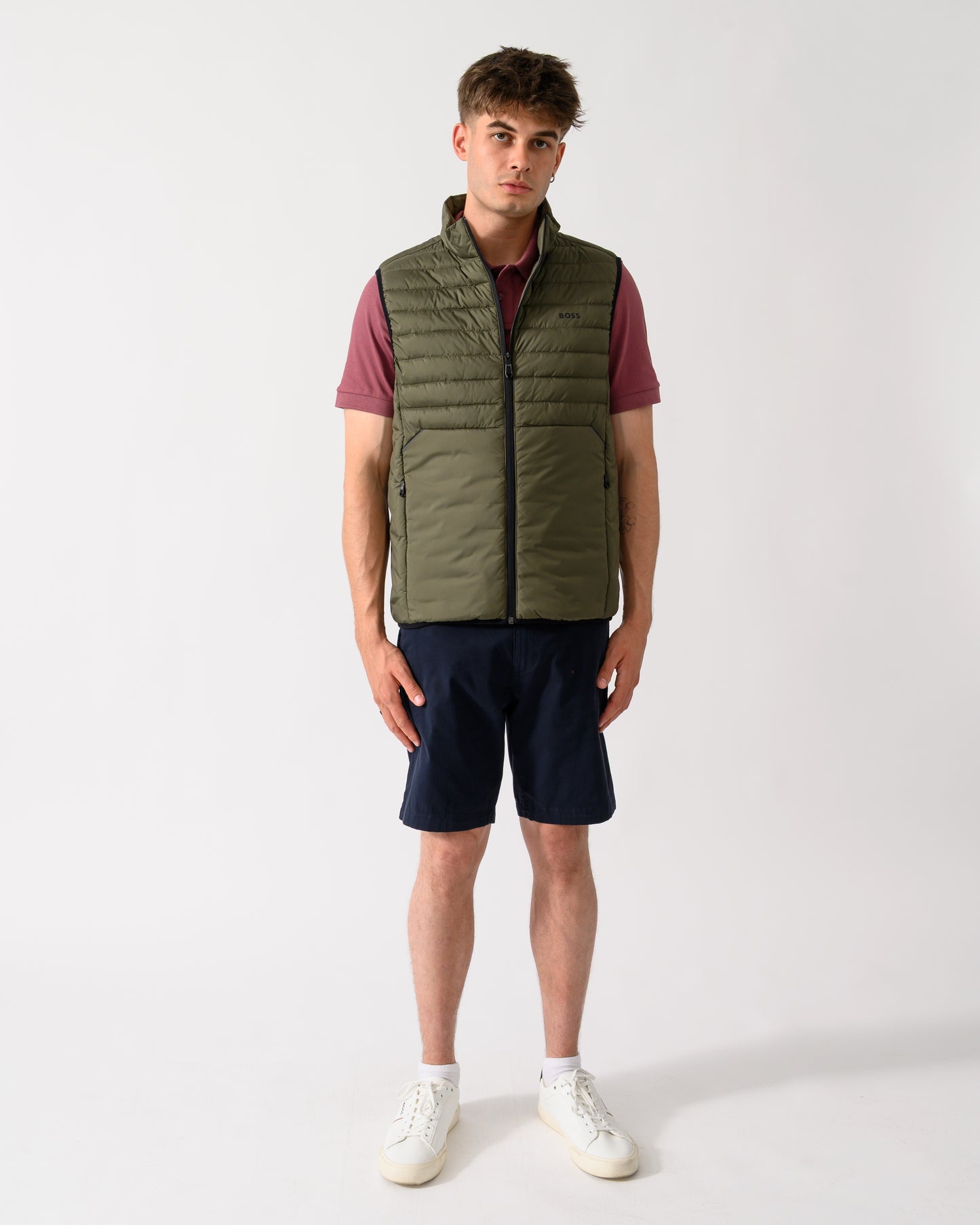 full length shot of a model wearing a BOSS Green Urbanex Mens Gilet in Open Green 398