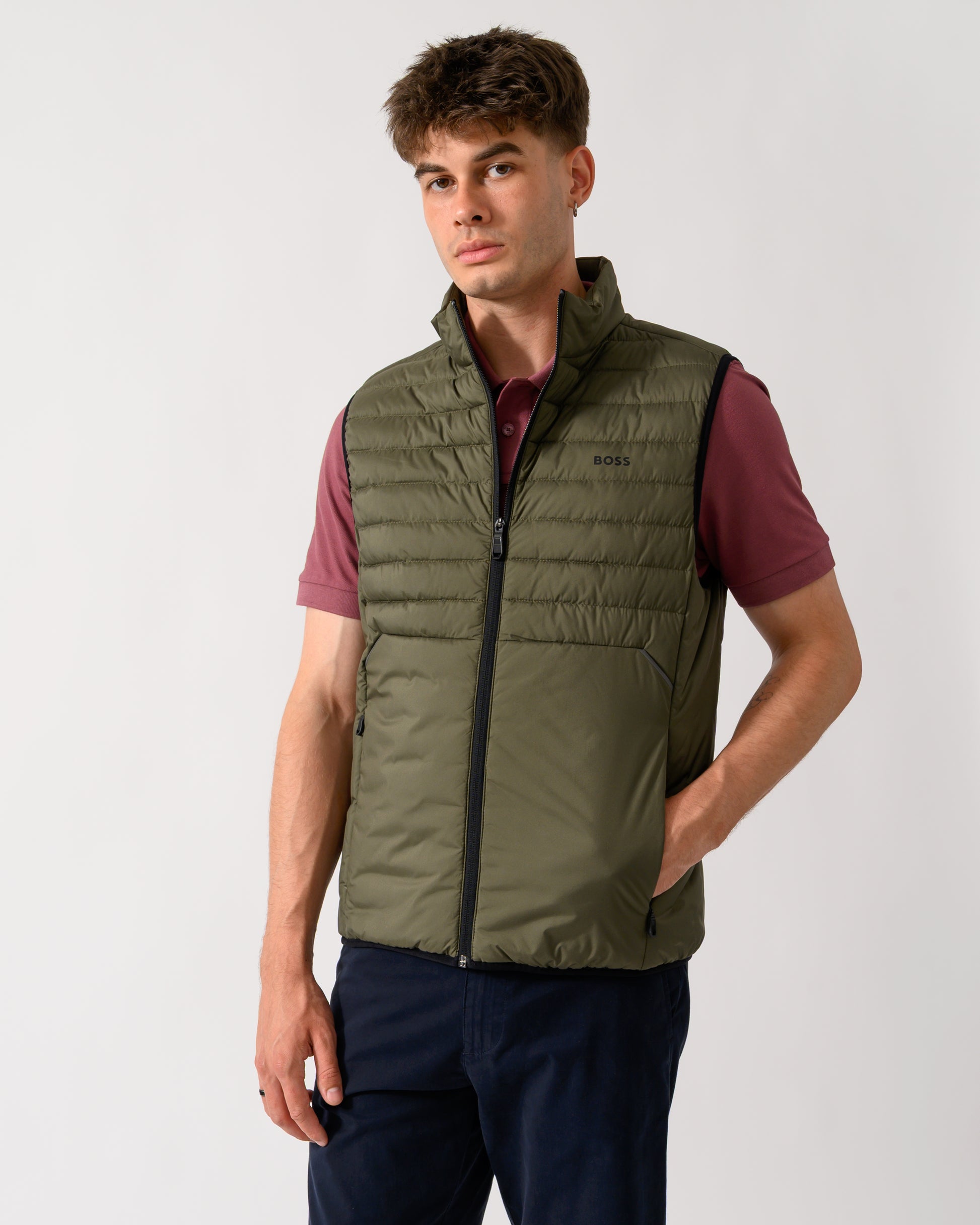 model wearing a BOSS Green Urbanex Mens Gilet in Open Green 398