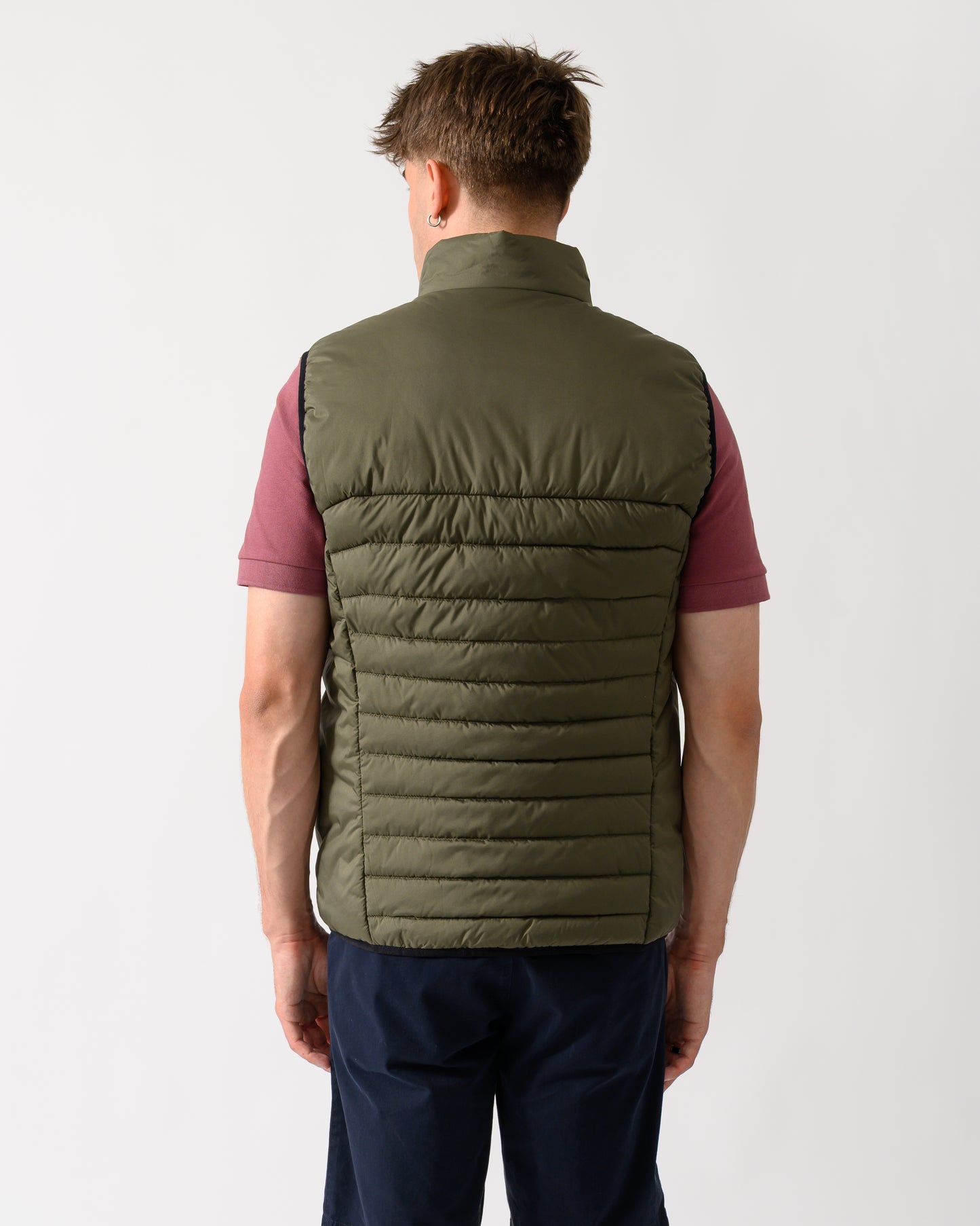 back shot of a model wearing a BOSS Green Urbanex Mens Gilet in Open Green 398