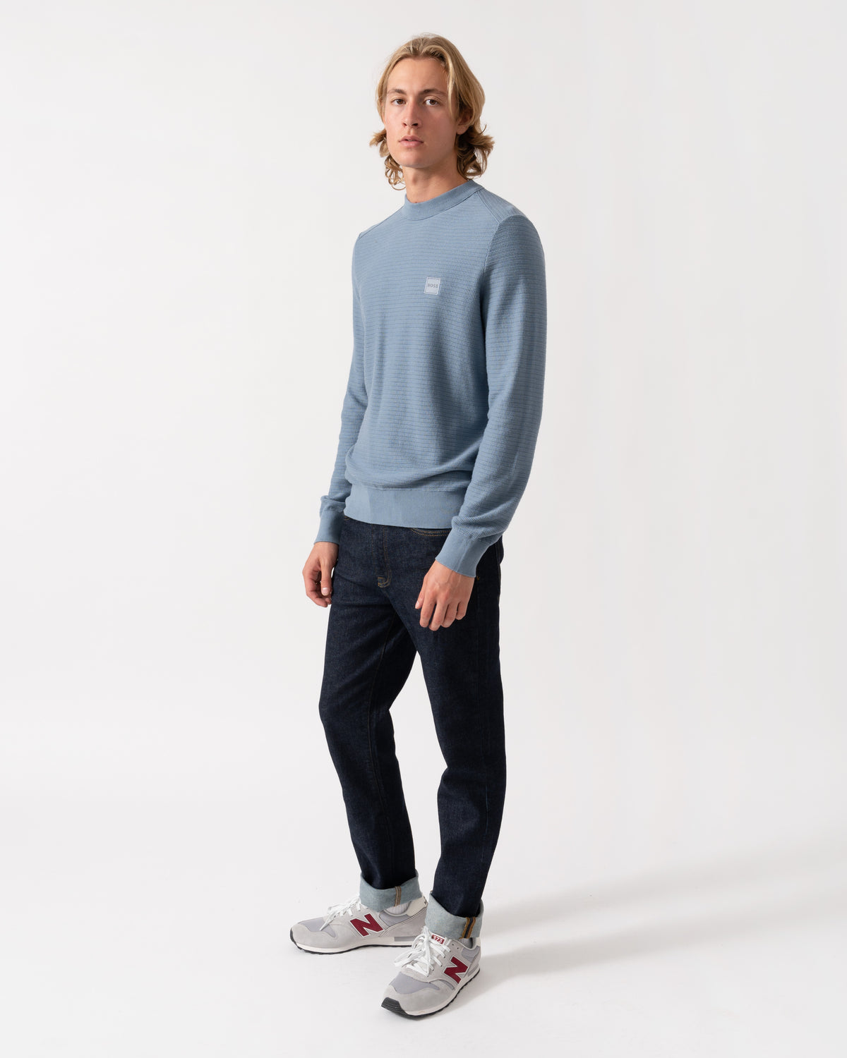 Model wearing the BOSS Orange Anion S Mens Crew Neck Jumper - Medium Blue 424