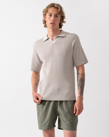 Model wearing a BOSS Orange Aravolo Mens Short Sleeve Knit Polo Shirt in Open Grey 070
