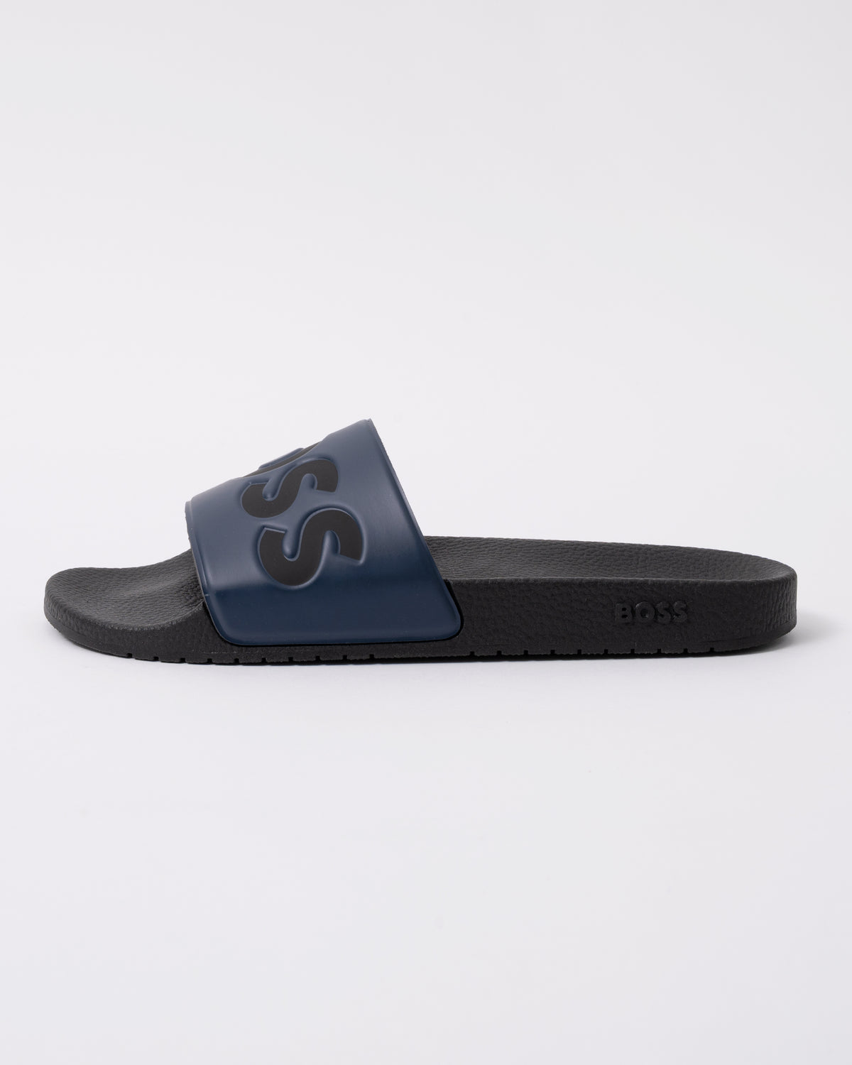 side view of BOSS Orange Aryeh Mens Italian-Made Slides With Large Logo Detail in Dark Blue 406