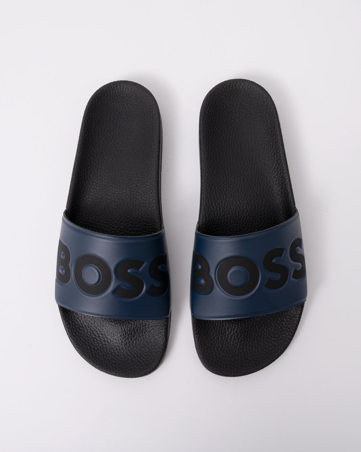 top view of BOSS Orange Aryeh Mens Italian-Made Slides With Large Logo Detail in Dark Blue 406