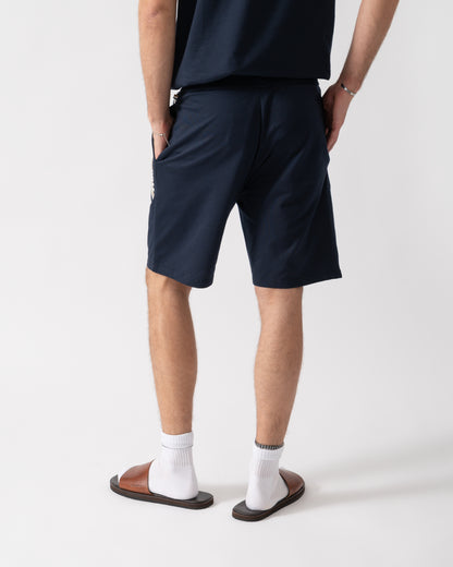 back of a model wearing a BOSS Orange Authentic Mens Loungewear Shorts with Stripe and Logo in Dark Blue 405