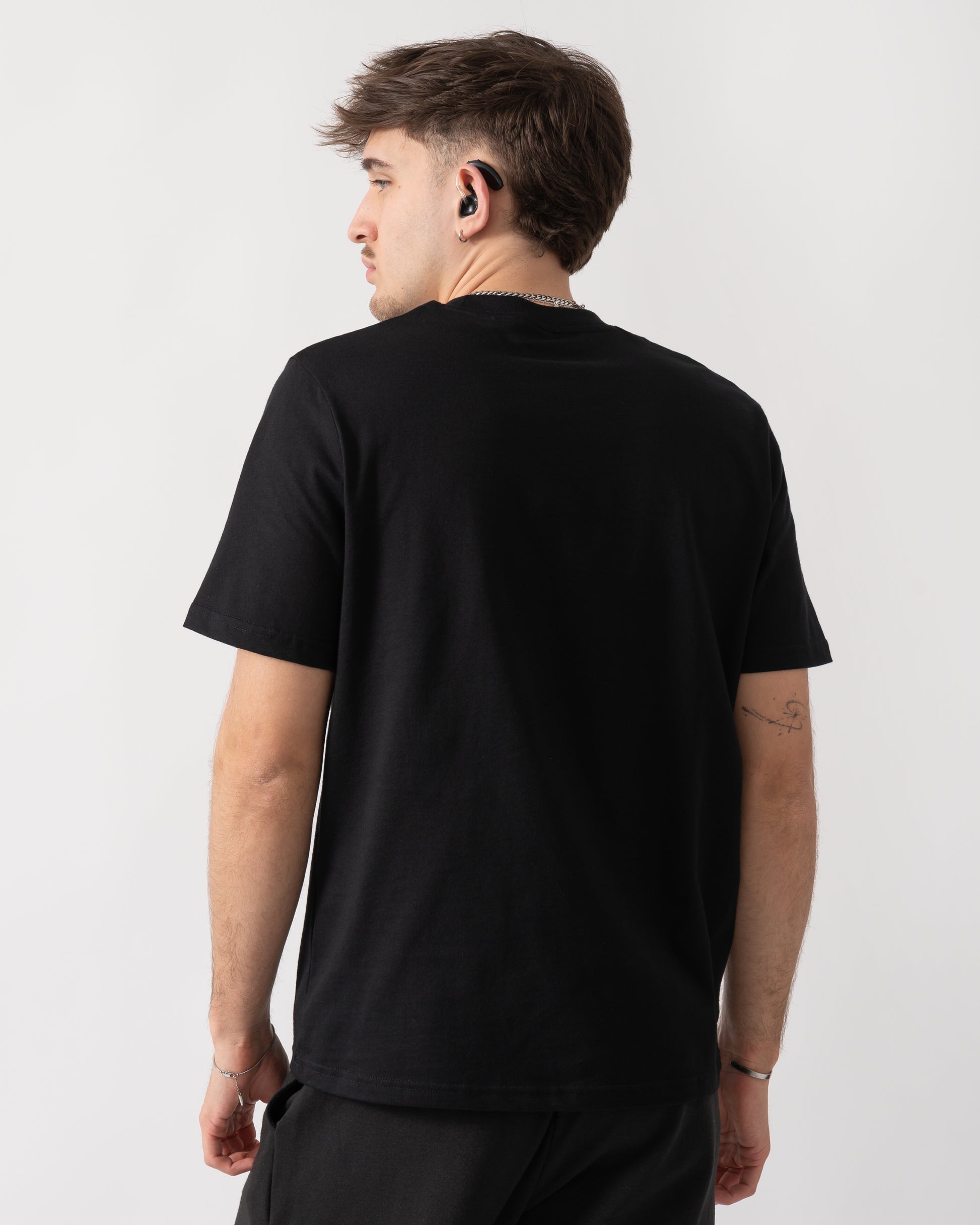 back shot of a model wearing a BOSS Orange Authentic Mens Loungewear T-Shirt in Black 004