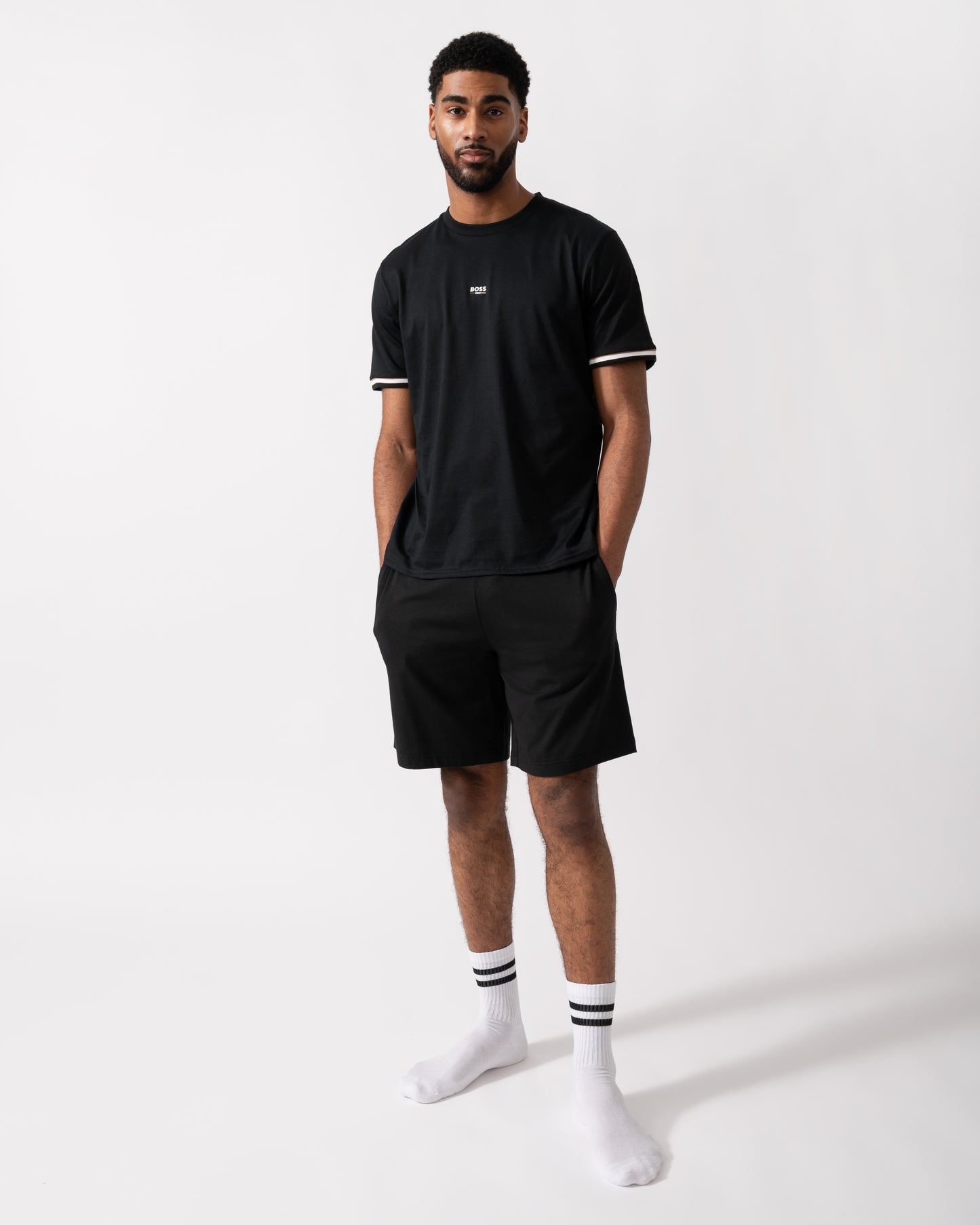 Full length shot of a Model wearing a BOSS Orange Iconic Mens Loungewear T-Shirt in Black